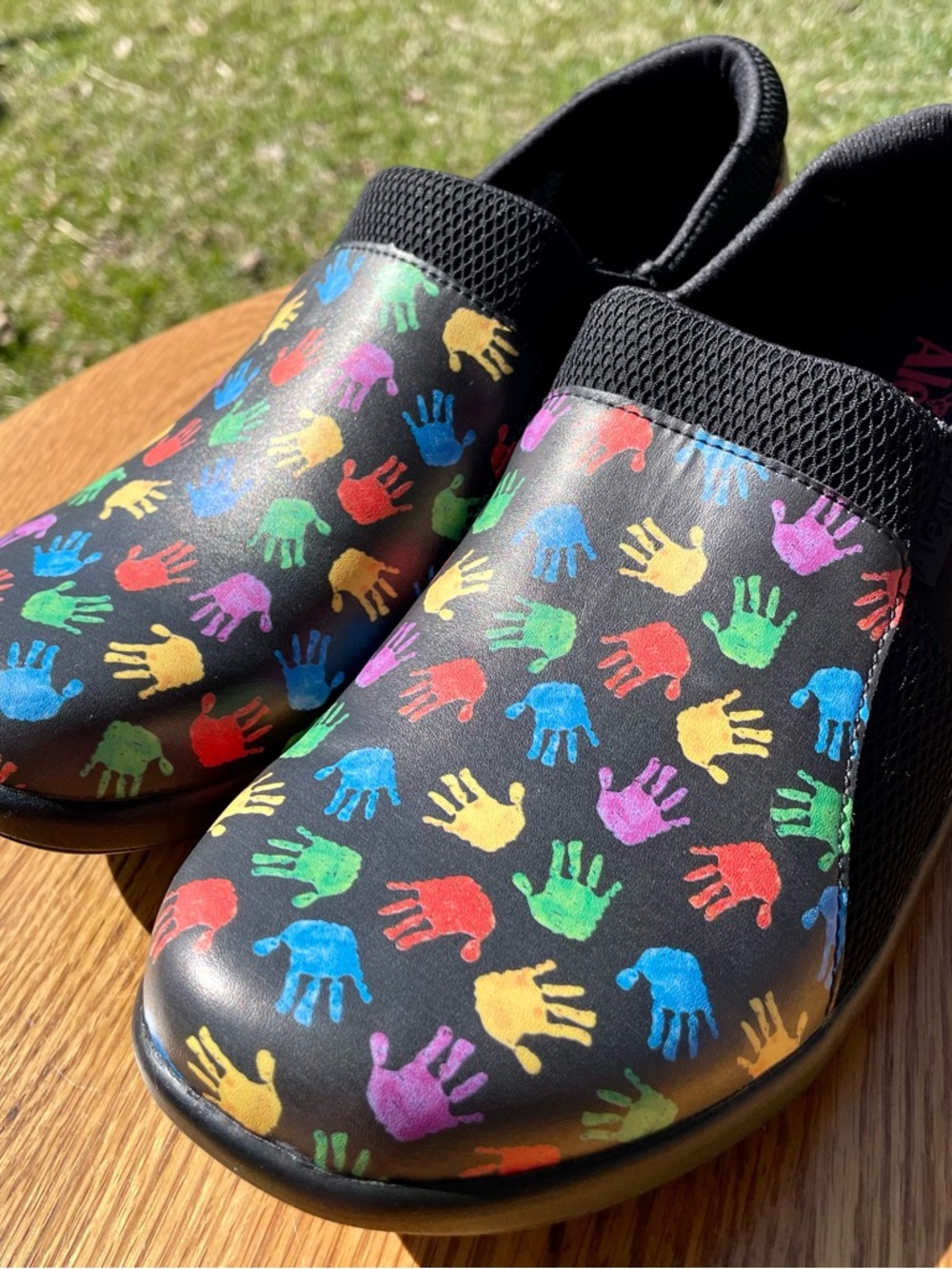 Alegria Duette Black Slip-On Clogs with Multicolor Handprint Pattern